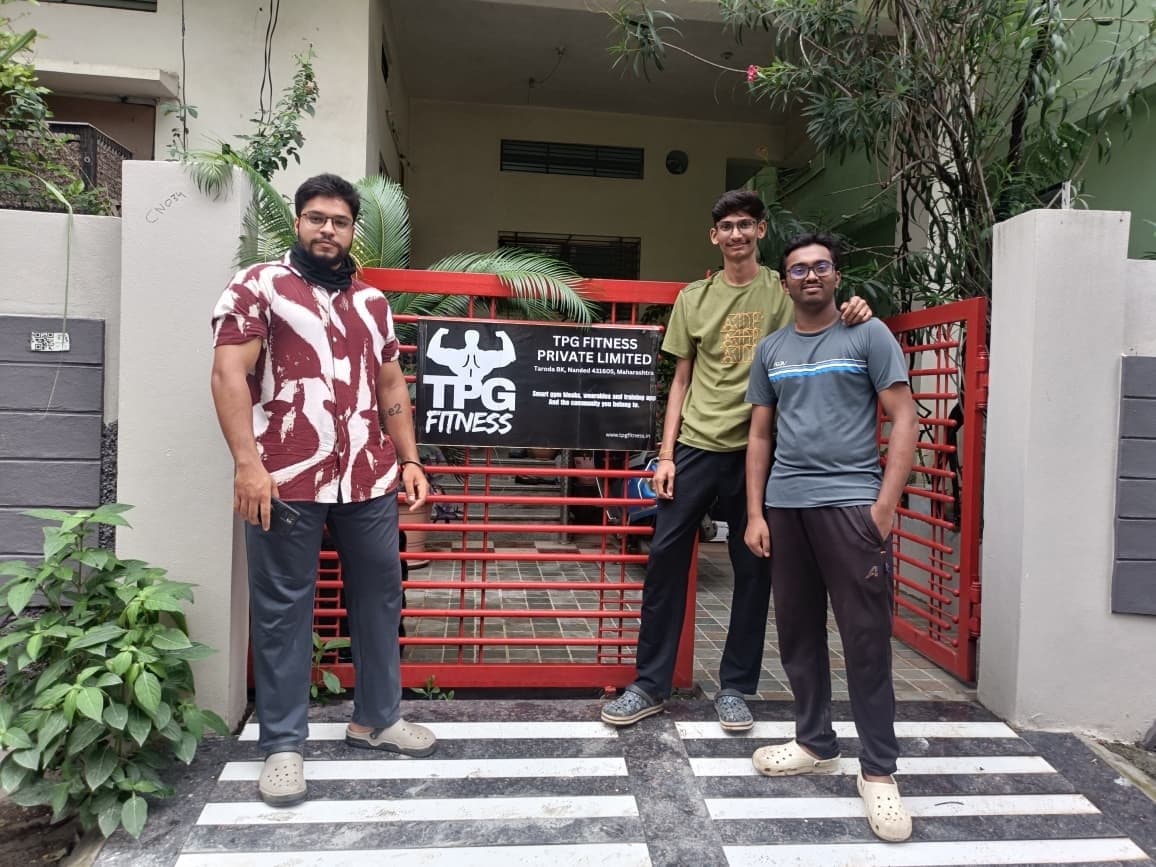 The TPG Fitness team standing outside the workshop gate